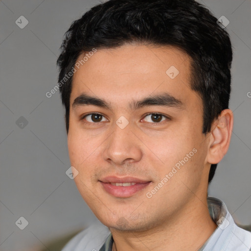 Joyful white young-adult male with short  black hair and brown eyes