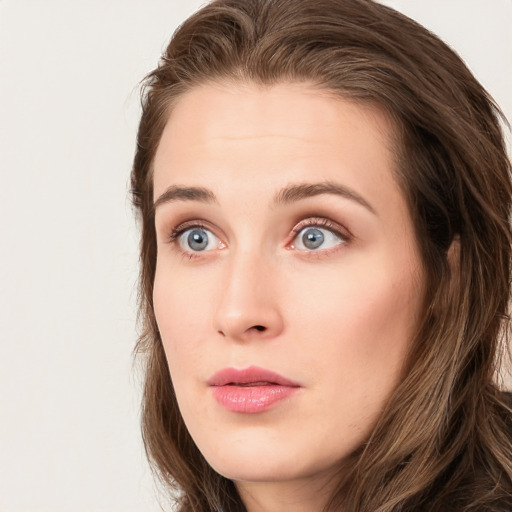 Neutral white young-adult female with long  brown hair and blue eyes