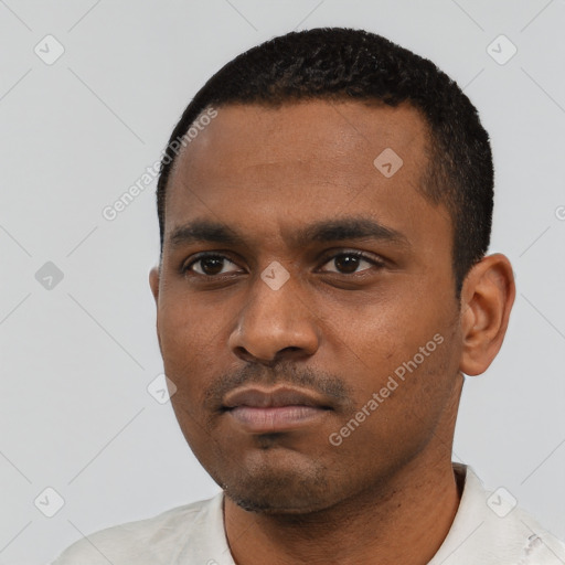 Neutral latino young-adult male with short  black hair and brown eyes