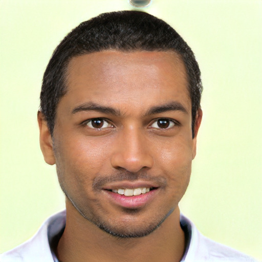 Joyful black young-adult male with short  black hair and brown eyes