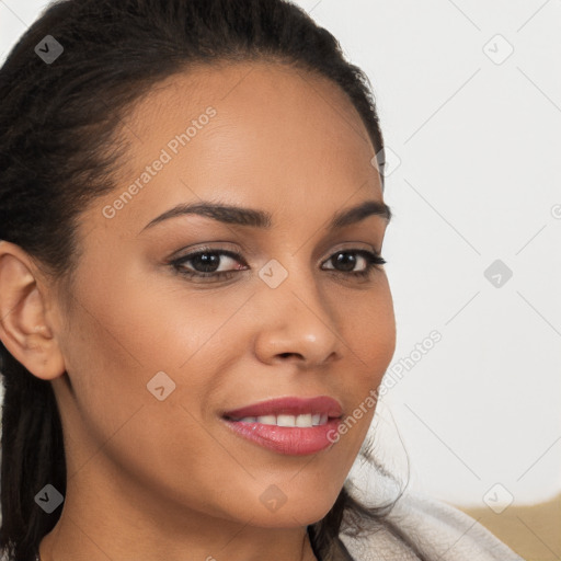 Joyful latino young-adult female with long  brown hair and brown eyes