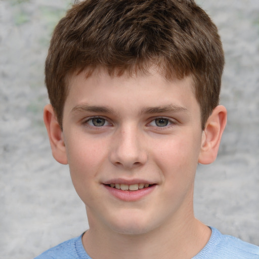 Joyful white child male with short  brown hair and grey eyes