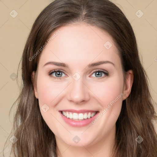 Joyful white young-adult female with long  brown hair and green eyes