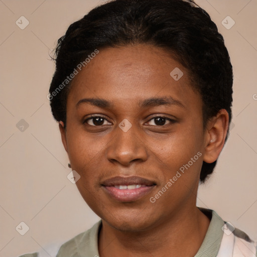 Joyful black young-adult female with short  black hair and brown eyes