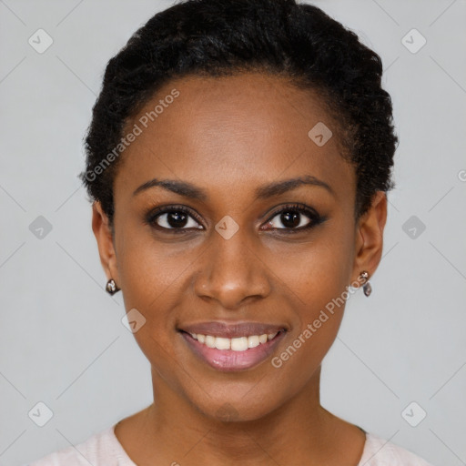 Joyful black young-adult female with short  black hair and brown eyes