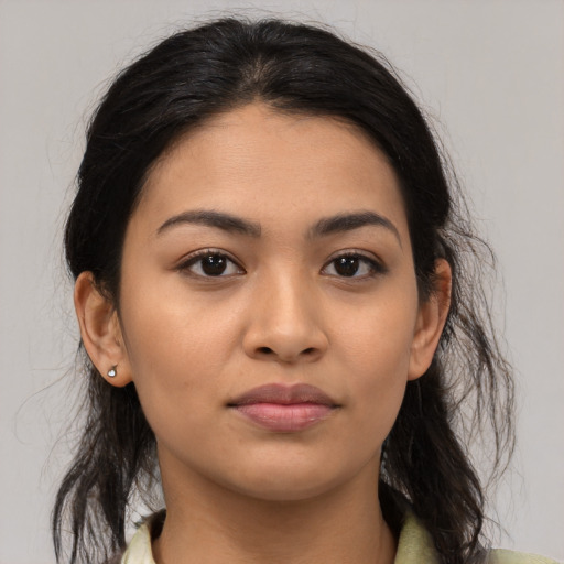 Joyful latino young-adult female with medium  black hair and brown eyes