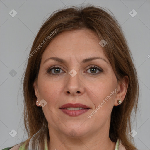 Joyful white adult female with medium  brown hair and grey eyes