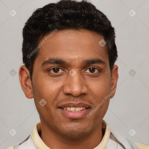 Joyful white young-adult male with short  black hair and brown eyes
