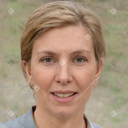 Joyful white adult female with short  brown hair and grey eyes