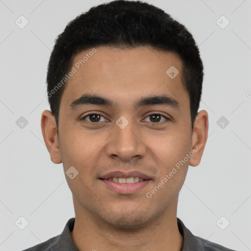 Joyful latino young-adult male with short  brown hair and brown eyes