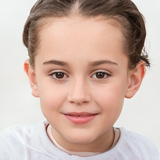 Joyful white child female with short  brown hair and brown eyes