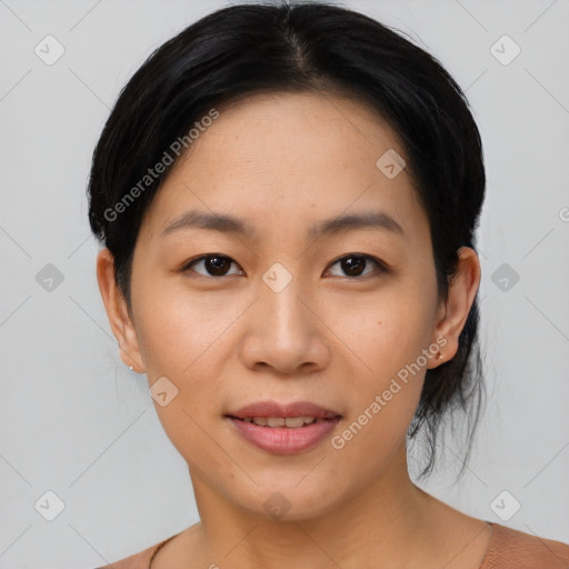 Joyful asian young-adult female with short  black hair and brown eyes