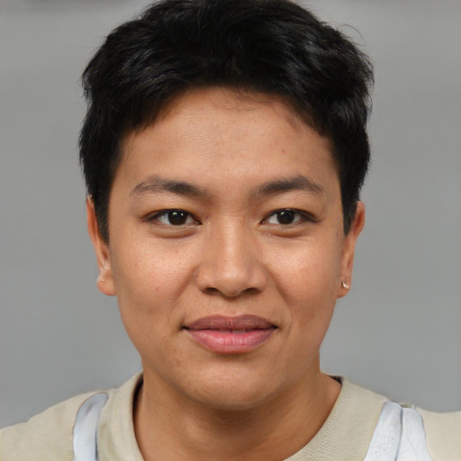 Joyful asian young-adult female with short  brown hair and brown eyes