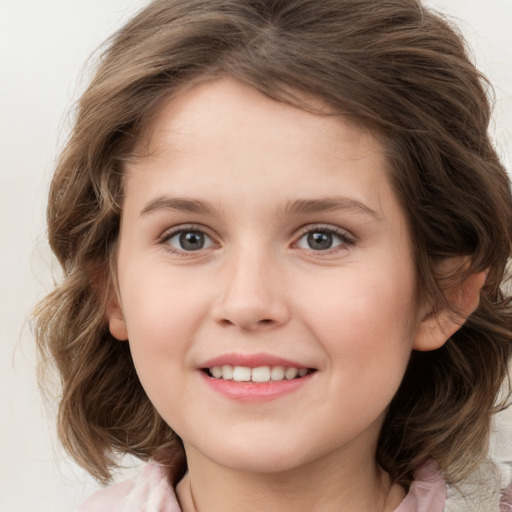 Joyful white child female with medium  brown hair and grey eyes