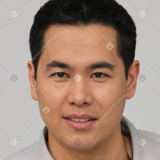 Joyful asian young-adult male with short  black hair and brown eyes