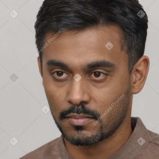 Neutral latino young-adult male with short  black hair and brown eyes