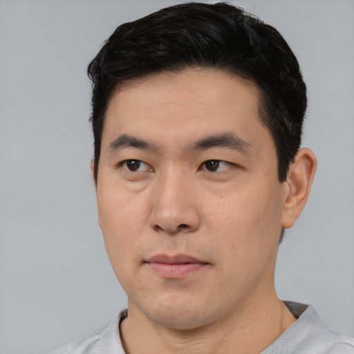 Neutral asian young-adult male with short  black hair and brown eyes
