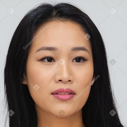 Joyful asian young-adult female with long  black hair and brown eyes