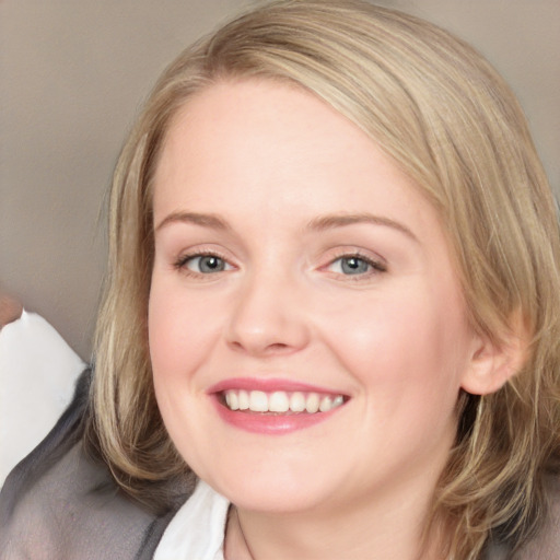 Joyful white young-adult female with medium  brown hair and blue eyes