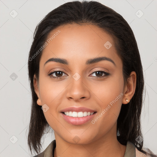 Joyful latino young-adult female with long  brown hair and brown eyes