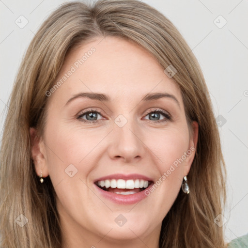 Joyful white young-adult female with long  brown hair and green eyes