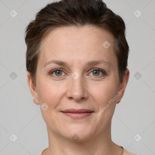 Joyful white adult female with short  brown hair and grey eyes