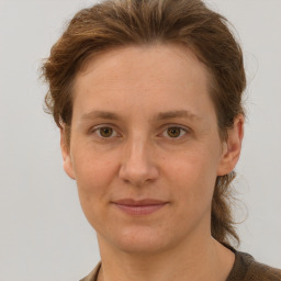 Joyful white adult female with short  brown hair and brown eyes