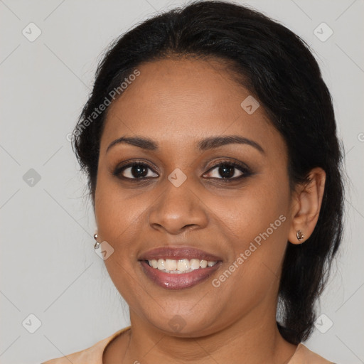 Joyful black young-adult female with medium  brown hair and brown eyes