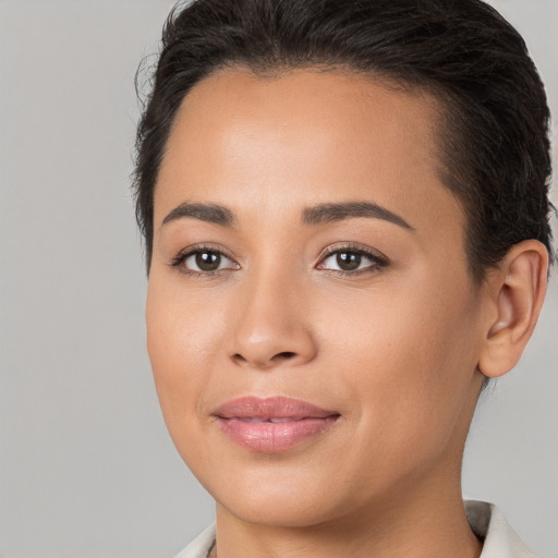 Joyful white young-adult female with short  brown hair and brown eyes