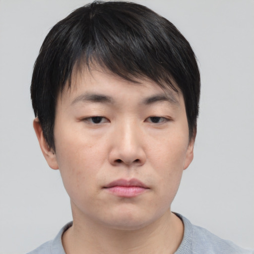 Neutral asian young-adult male with short  brown hair and brown eyes