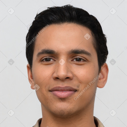 Joyful latino young-adult male with short  black hair and brown eyes