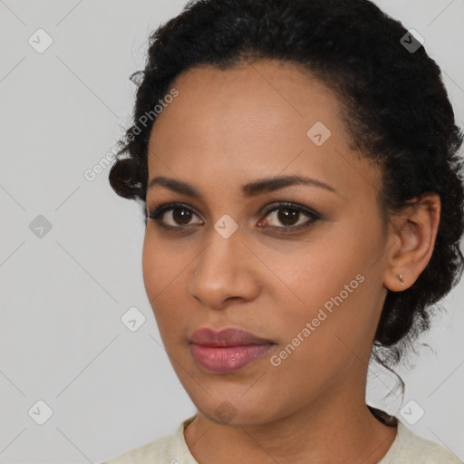 Joyful black young-adult female with medium  black hair and brown eyes