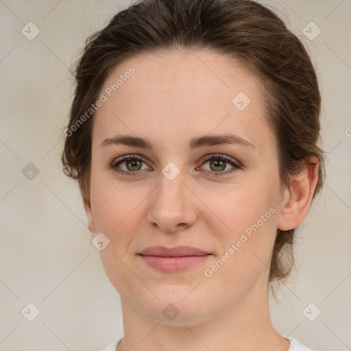 Joyful white young-adult female with medium  brown hair and green eyes