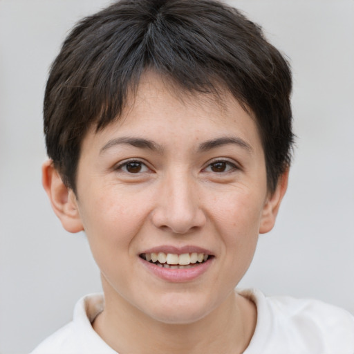 Joyful white young-adult female with short  brown hair and brown eyes