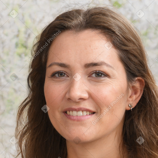 Joyful white adult female with long  brown hair and brown eyes