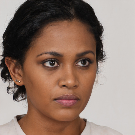 Neutral black young-adult female with medium  black hair and brown eyes