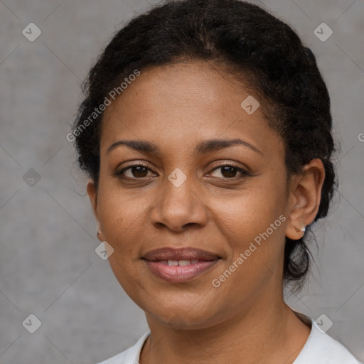 Joyful black adult female with short  brown hair and brown eyes