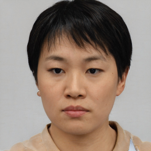 Neutral asian young-adult female with short  black hair and brown eyes