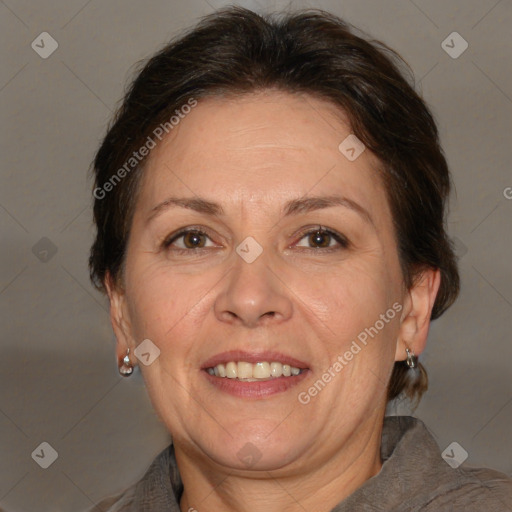 Joyful white adult female with medium  brown hair and brown eyes