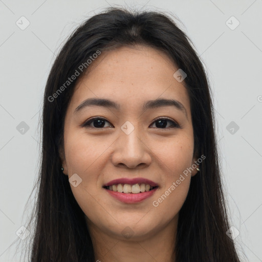 Joyful asian young-adult female with long  brown hair and brown eyes