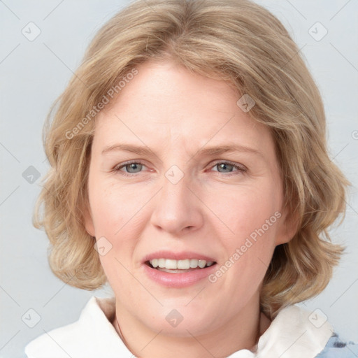 Joyful white adult female with medium  brown hair and blue eyes