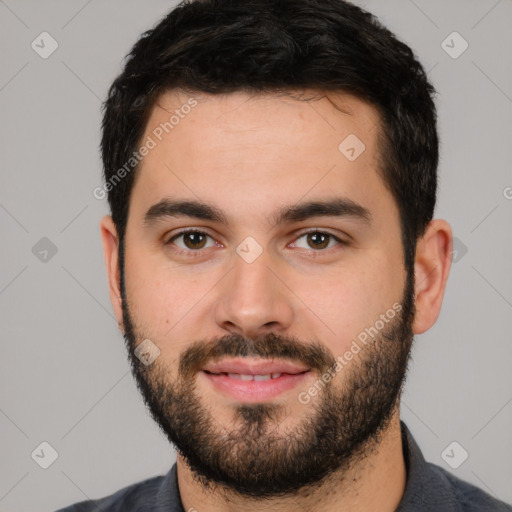 Joyful white young-adult male with short  black hair and brown eyes