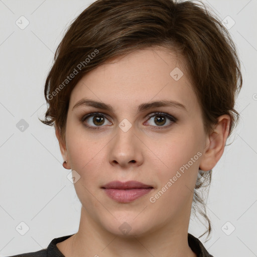 Joyful white young-adult female with medium  brown hair and green eyes