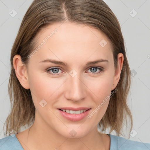 Joyful white young-adult female with medium  brown hair and blue eyes