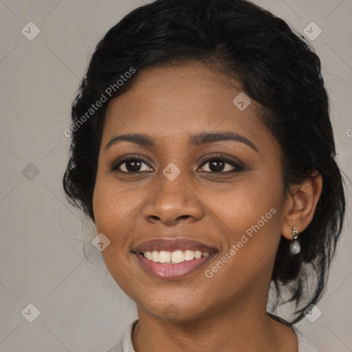 Joyful black young-adult female with medium  black hair and brown eyes