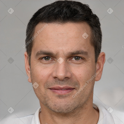 Joyful white adult male with short  brown hair and brown eyes