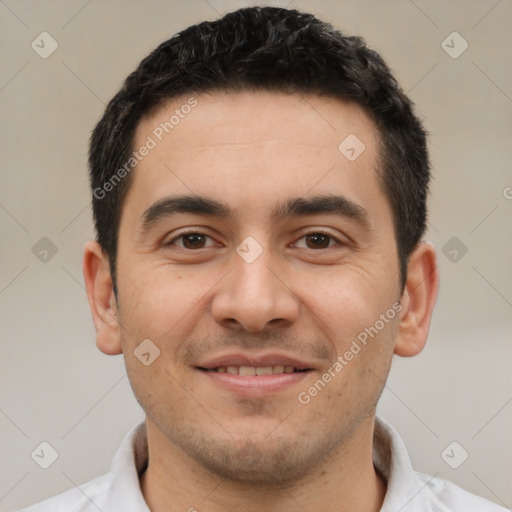 Joyful white young-adult male with short  black hair and brown eyes