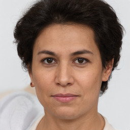 Joyful white adult female with short  brown hair and brown eyes