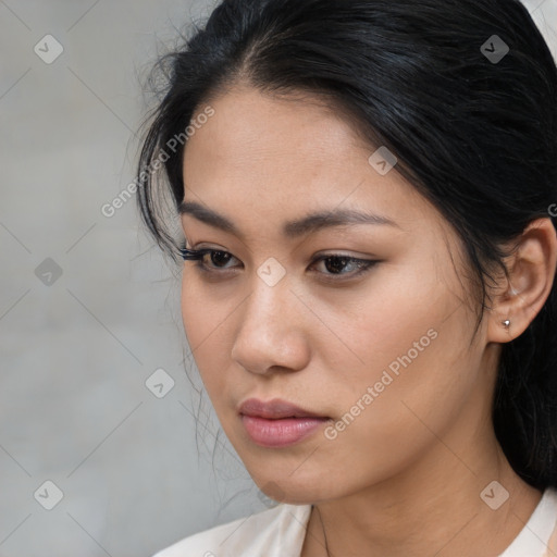 Neutral asian young-adult female with medium  brown hair and brown eyes