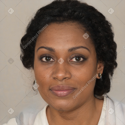 Joyful black adult female with medium  brown hair and brown eyes